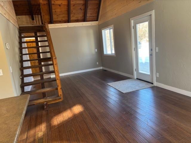 entrance foyer with wood ceiling, dark hardwood / wood-style flooring, and lofted ceiling with beams