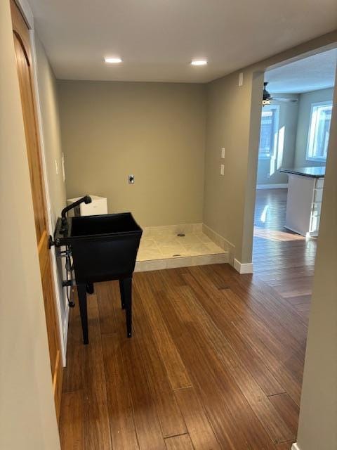 misc room with hardwood / wood-style flooring and ceiling fan