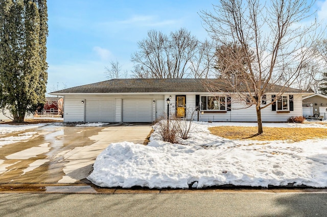 view of front of home featuring an attached garage and driveway