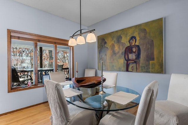 dining space featuring light wood-type flooring