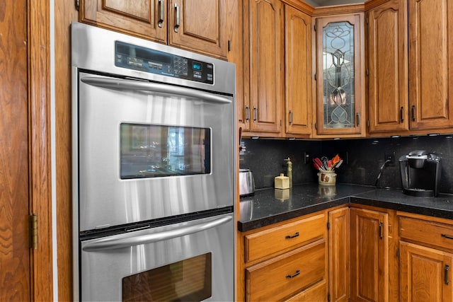 kitchen with double oven and decorative backsplash