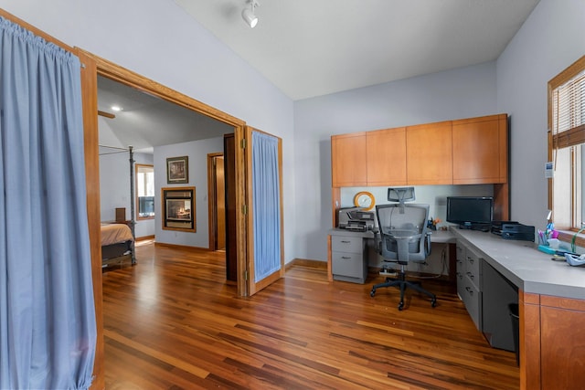 office space with dark wood-type flooring and lofted ceiling