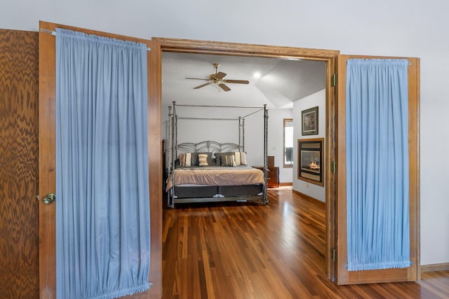 bedroom featuring vaulted ceiling and hardwood / wood-style floors