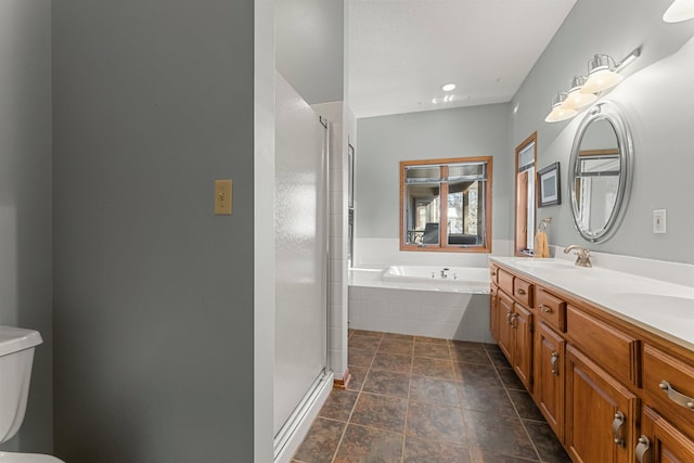 full bathroom with vanity, independent shower and bath, and toilet