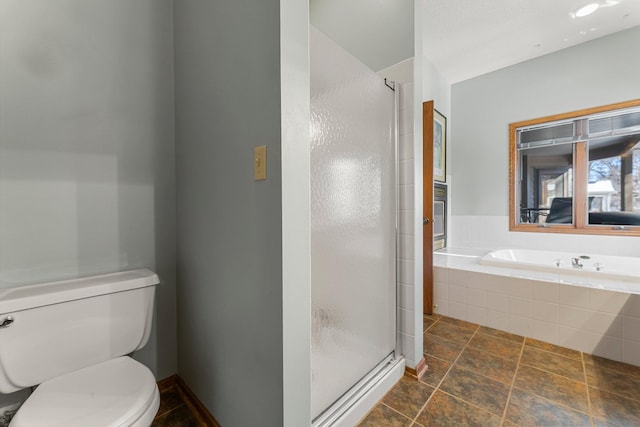 bathroom featuring plus walk in shower and toilet