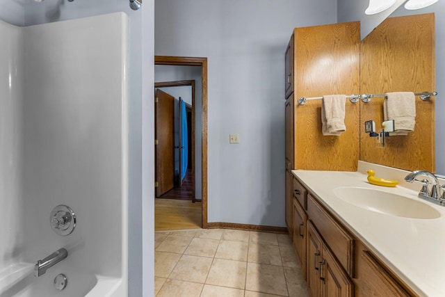 bathroom with tile patterned flooring, vanity, and shower / bath combination