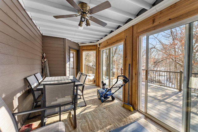 sunroom / solarium featuring ceiling fan