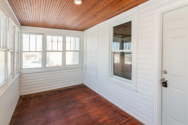 unfurnished sunroom with wood ceiling