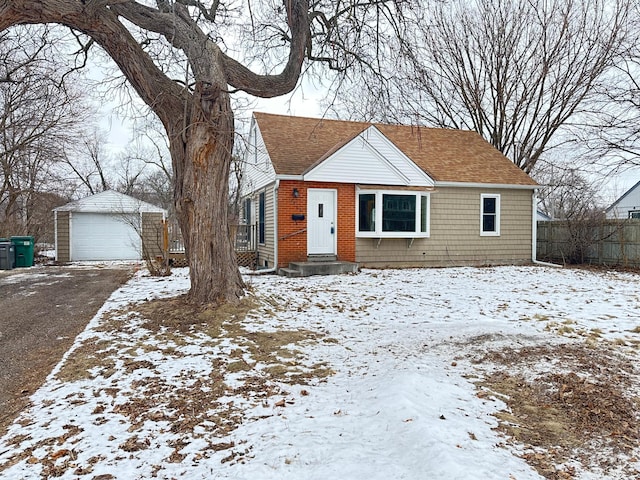 bungalow-style home featuring an outbuilding and a garage