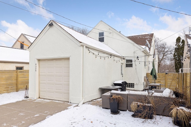 exterior space featuring a garage and an outdoor structure