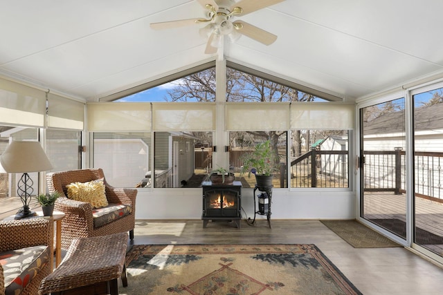 sunroom / solarium with lofted ceiling and ceiling fan