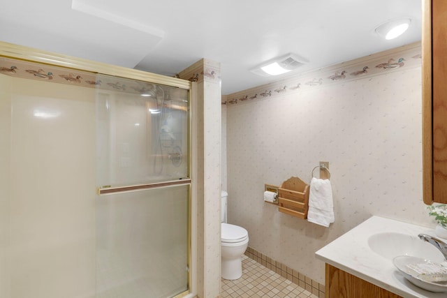 full bathroom featuring wallpapered walls, a shower stall, toilet, and tile patterned flooring