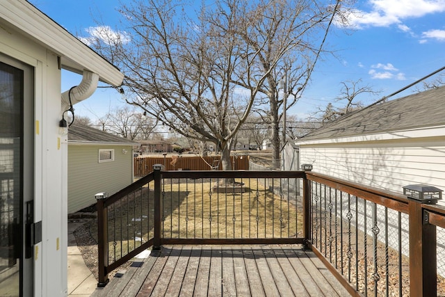 deck with a fenced backyard