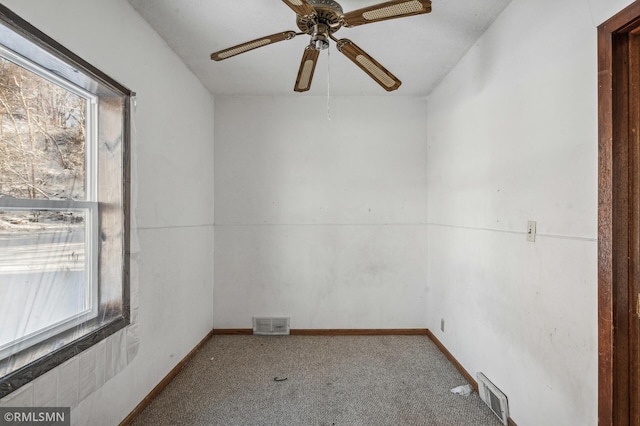 unfurnished room with a healthy amount of sunlight and carpet floors