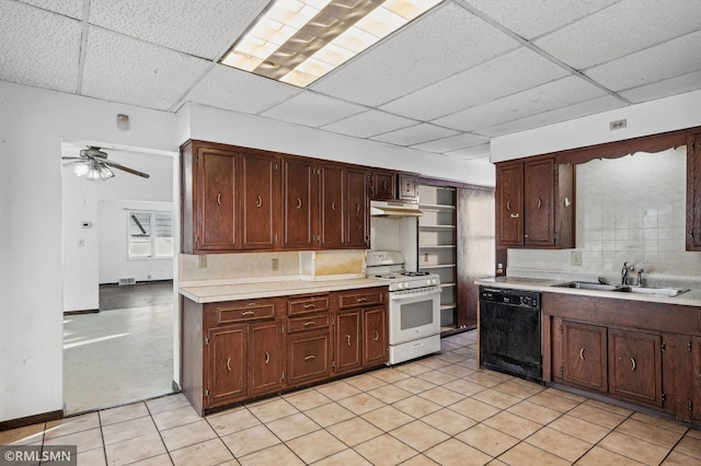 kitchen with gas range gas stove, a paneled ceiling, black dishwasher, sink, and dark brown cabinets