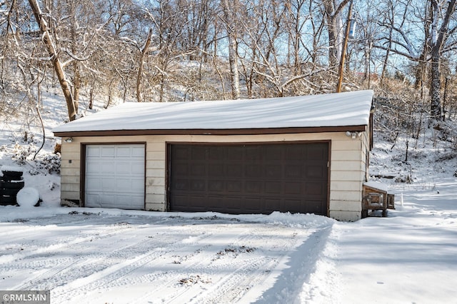 view of snow covered garage