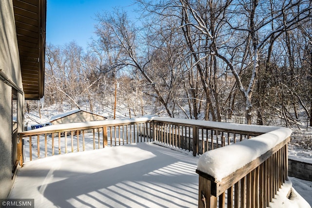 view of snow covered deck