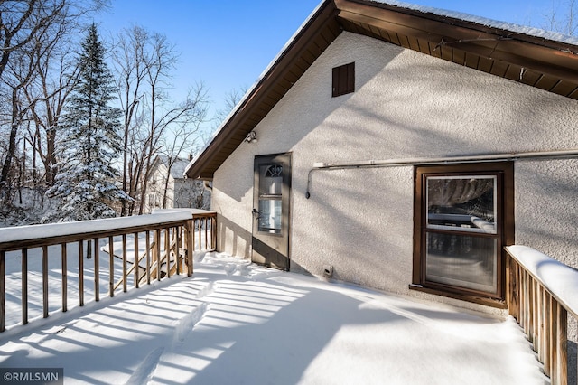 view of snow covered deck