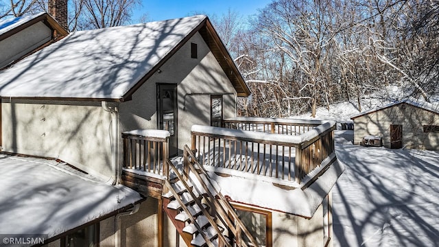 view of snow covered deck