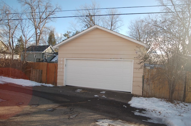 view of snow covered garage