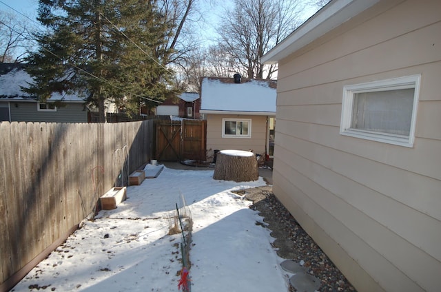 view of yard layered in snow