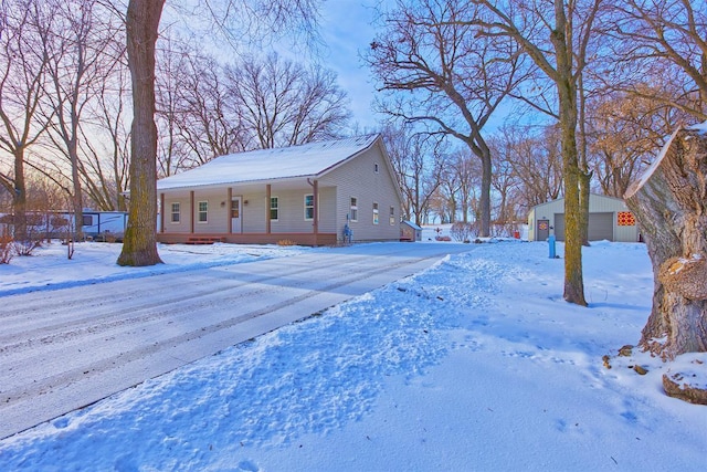 snowy yard featuring a porch