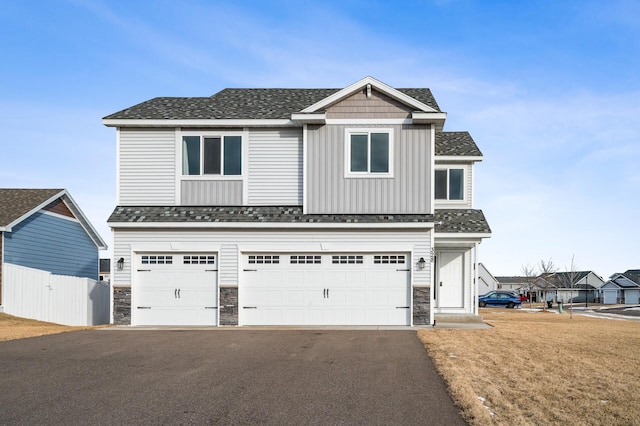 view of front facade with a garage and a front yard