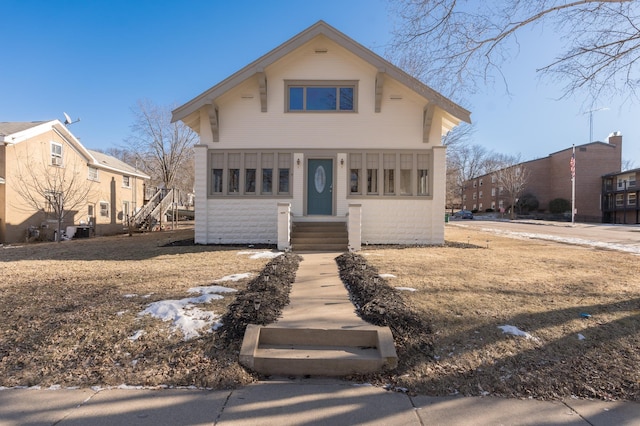 bungalow featuring central AC unit