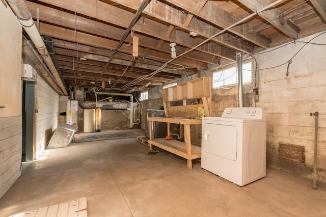 basement with washer / clothes dryer and water heater