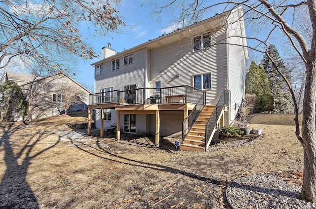 back of property featuring a deck