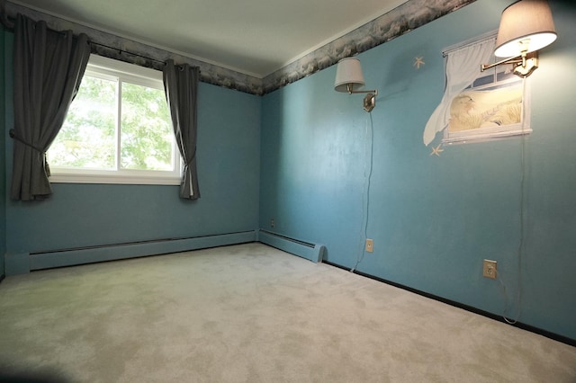 carpeted empty room with a baseboard heating unit