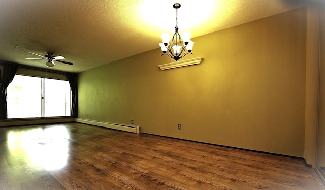 empty room with wood-type flooring, a textured ceiling, a baseboard heating unit, and ceiling fan with notable chandelier