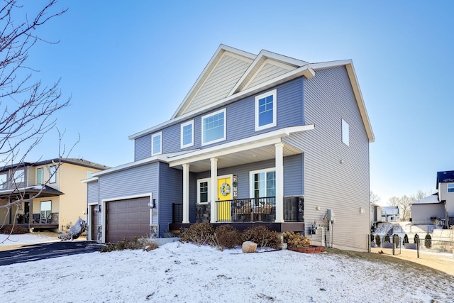 view of front of property featuring a porch and a garage