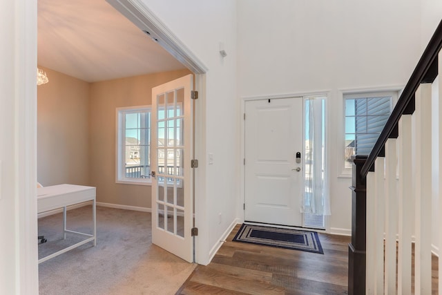 entryway with stairs and baseboards