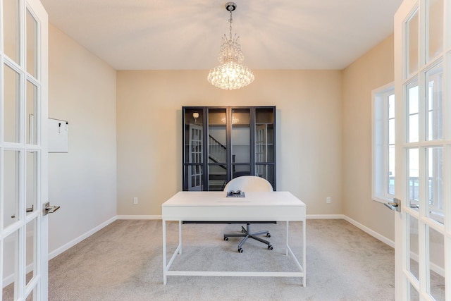 office area featuring a chandelier, french doors, light carpet, and baseboards