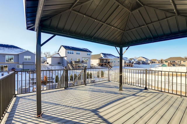 wooden deck featuring a residential view and a gazebo