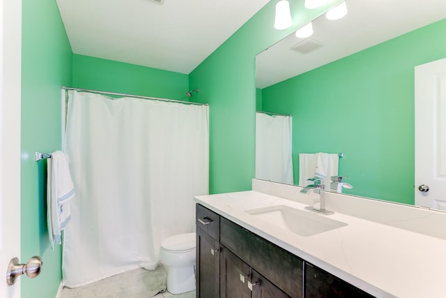 full bath featuring visible vents, vanity, and toilet