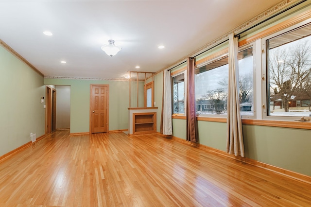 unfurnished living room featuring light hardwood / wood-style flooring