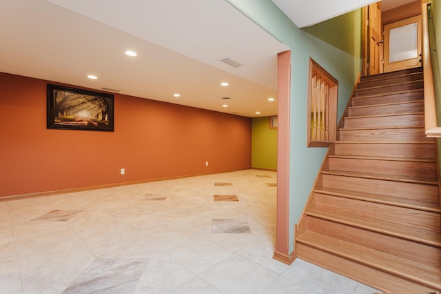 basement with light tile patterned flooring