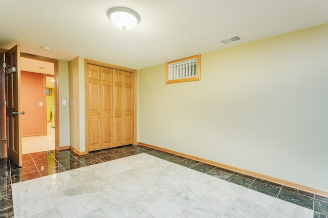 unfurnished bedroom featuring a closet