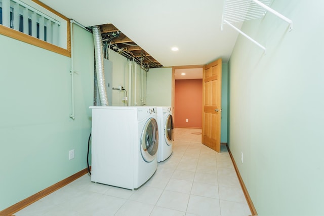 clothes washing area with washing machine and dryer