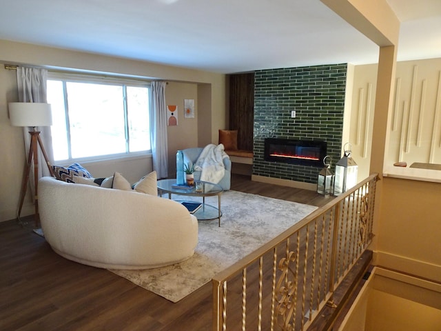 living room with hardwood / wood-style floors and a tile fireplace