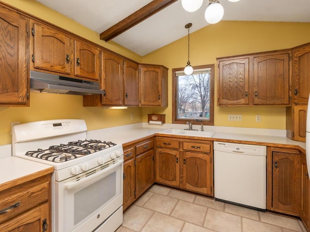 kitchen featuring hanging light fixtures, lofted ceiling, sink, and white appliances