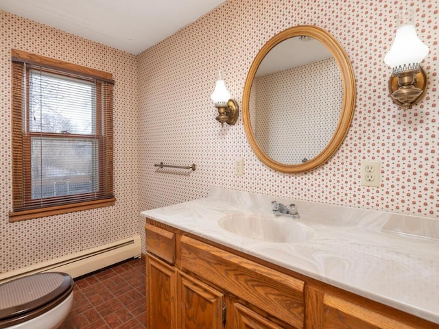 bathroom featuring vanity, a baseboard radiator, and toilet