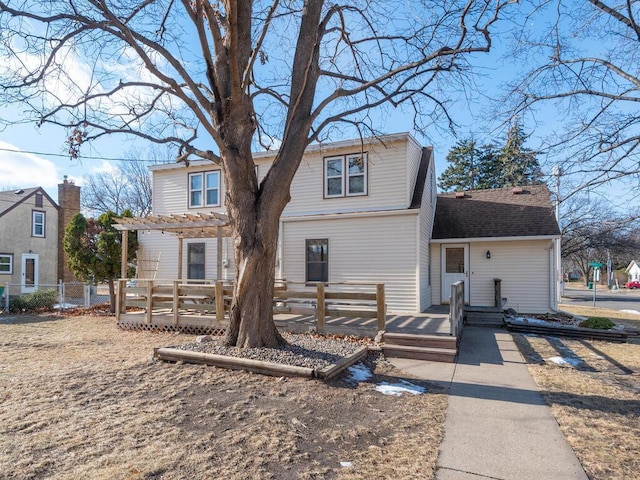 back of house featuring a pergola