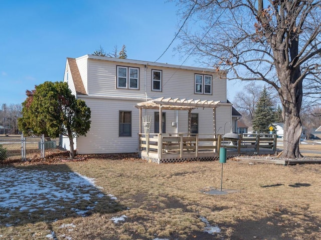 rear view of property with a pergola and a deck