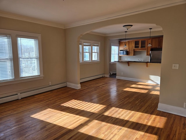 unfurnished living room featuring a baseboard radiator, ornamental molding, and dark hardwood / wood-style floors