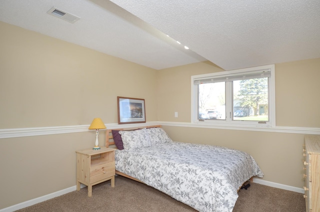 bedroom with baseboards, carpet, and visible vents