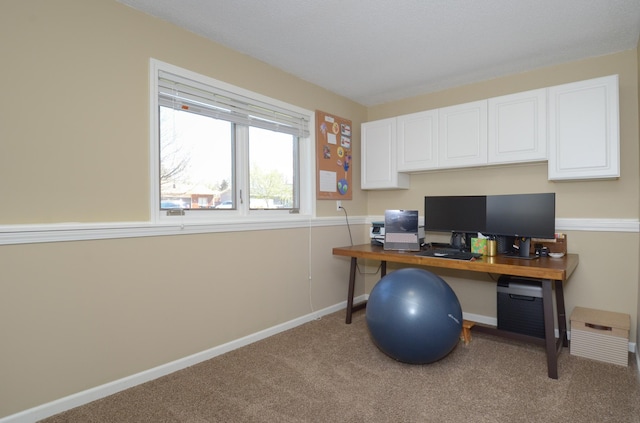 office space featuring carpet floors and baseboards