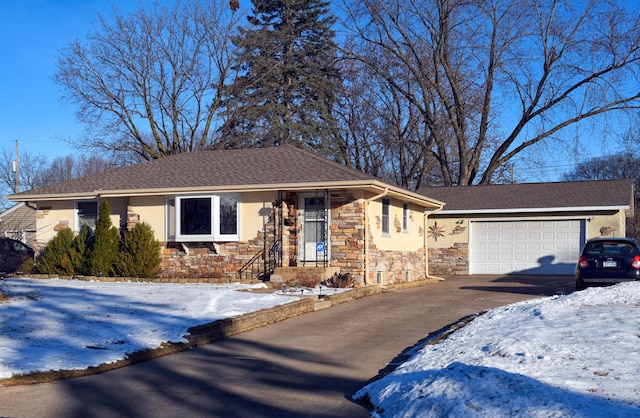 ranch-style house featuring a garage